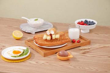 Delicious Morning Breakfast Spread with Fritters, Sandwich and Fresh Treats in Warm Sunshine