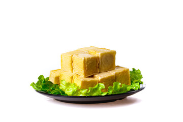 Fresh Tofu Blocks with Lettuce Garnish on Plate - Healthy Vegetarian Protein Food Ingredient