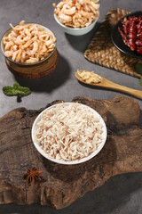 Dried Shrimp Flakes and Asian Seafood Ingredients on Wooden Board with Spices