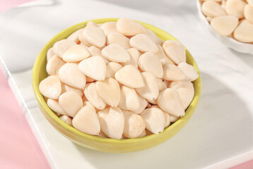 Peeled Sliced Sweet Almonds in Bowl - Healthy Nuts Snack and Cooking Ingredient