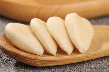 Peeled Sliced Sweet Almonds on Wooden Board - Fresh Nuts for Cooking and Baking