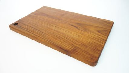 Rectangular teak wood chopping board with natural wood motif, 20mm thick, safe for use with cooking utensils, isolated on white background
