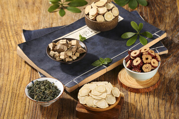 Traditional Chinese Medicine Ginseng and Herbal Remedies on Wooden Table