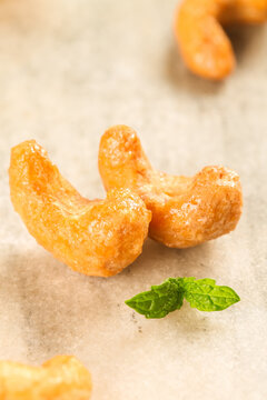 Crispy Fried Cashew Nuts with Fresh Mint - Golden Amber Kernels Snack Food Photography