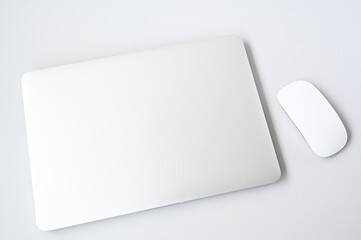 Laptop and Mouse on Clean White Table &mdash; Modern Minimal Office Flat Lay