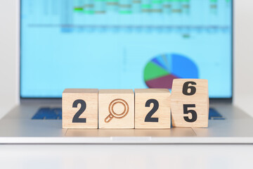 2025 end year to Happy New Year 2026 block with magnifying glass icon against laptop computer. SEO,...