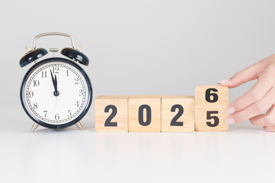 2025 end year to Happy New Year 2026 with vintage alarm clock. Christmas, New Start, Resolution, countdown, Goals, Plan, Action and Motivation Concept