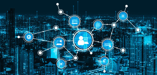 Futuristic digital network overlays a vibrant city skyline at night, illustrating advanced...