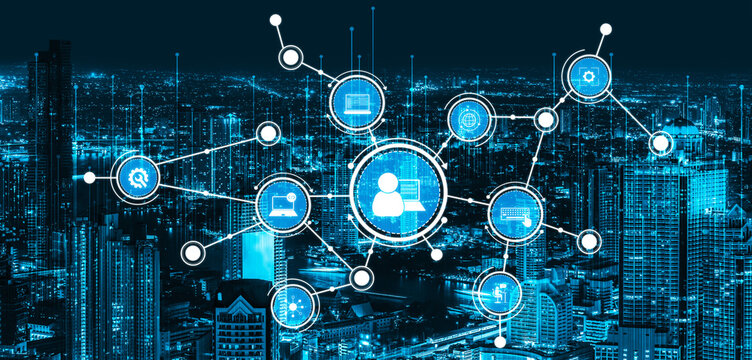 Futuristic digital network overlays a vibrant city skyline at night, illustrating advanced technology connections and modern user interactions through striking blue graphics. Tessel