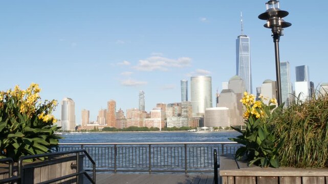 New York City Manhattan downtown financial district skyline, New Jersey Exchange Place, United States. Urban cityscape with skyscraper buildings, World Trade Center. J Owen Grundy park, Paulus Hook.