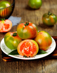 Fresh Heirloom Tomatoes Multi-Colored Variety on White Plate - Organic Produce Choice