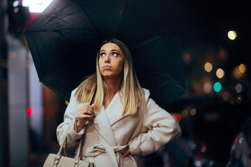 Stressed Woman Went for an Evening Walk in the Rain. Unhappy concerned lady feeling cold and bored waiting in rainy weather