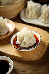 Handmade Mongolian Siu Mai Dumplings with Spicy Sauce on Wooden Tray - Hohhot Traditional Pure Meat Filling