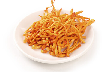 Golden Cordyceps and Chrysanthemum Traditional Chinese Medicine Herbs on White Plate