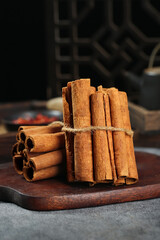 Long Natural Cinnamon Sticks from Guangxi China Bundled on Wooden Board - Aromatic Cooking Spice Seasoning