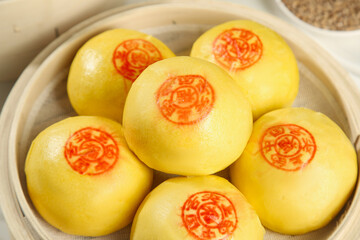 Traditional Chinese Handmade Steamed Buns with Fortune Stamps from Shandong in Bamboo Steamer