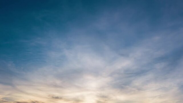 Evening sky time-lapse capturing the shift from sunset glow to nighttime darkness with subtle cloud movement.