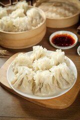Chinese Steamed Dumplings Siu Mai with Bamboo Steamers and Dipping Sauce Traditional Asian Cuisine