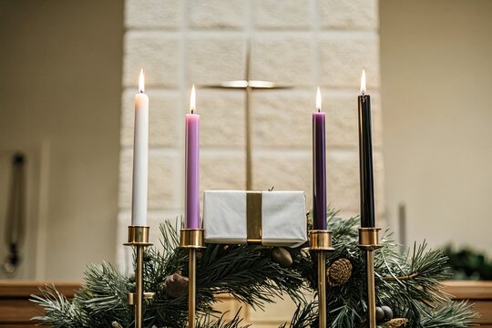 The first Sunday of Advent is symbolized by one lit candle on a traditional evergreen wreath in a peaceful church - Powered by Adobe