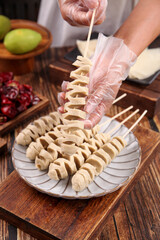 Handmade Gluten Skewers Preparation - Traditional Asian Food Making Process on Wooden Background