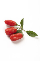 Fresh Red Wolfberries Ningxia Goji Berries with Leaves on White Background