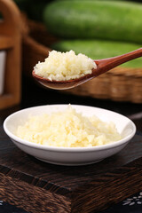 Fresh Shandong Farm Garlic Minced in Bowl with Wooden Spoon for Cooking