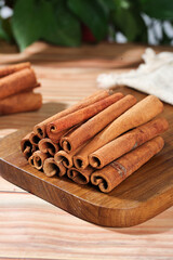Natural Cinnamon Bark Sticks from Guangxi China on Wooden Board - Premium Cooking Spices