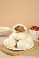 Handmade Pork Buns with Scallion Filling - Fresh Chinese Dumplings on Wooden Board