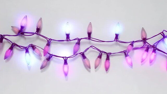 Strand of colorful christmas lights isolated on white background for decoration.