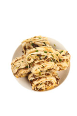 Handmade Chinese Scallion Pork Pancakes Rolled and Sliced on White Plate