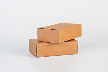 Small brown cardboard box on a white background.