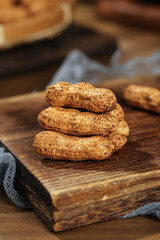 Stack of Fresh Roasted Peanuts in Shell on Wooden Board - Natural Healthy Snack Food Picture