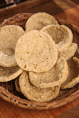 Crispy Spiced Tofu Crackers in Bamboo Basket - Traditional Henan Vegetarian Snack Food
