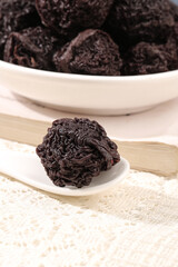Dried Plums Prunes in White Ceramic Spoon and Bowl Traditional Preserved Fruit