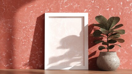 White picture frame template on coral terrazzo wall with fiddle leaf fig shadows and natural textures