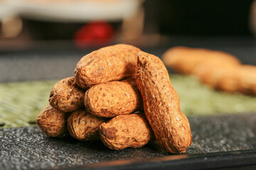 Fresh raw peanuts in shell on slate board kitchen food photography