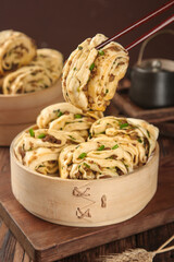 Handmade Pork and Scallion Pasta Rolls in Bamboo Steamer - Traditional Asian Cuisine