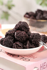 Dried Candied Plum Fruits in Bowl - Traditional Asian Preserved Snack Food Ingredient