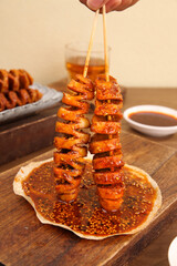 Homemade Spiced Tofu Skewers with Chili Sauce - Asian Street Food Appetizer on Wooden Board