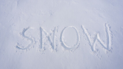 Winter text on snowy background. Snowy print design for winter. Frosty winter text outdoors. Winter text with snowflakes. Icy background with snow banner. Snowy field with snow print.