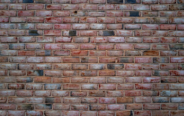Brick wall, vintage texture. Red brick wall for construction themes. Brick wall background. Textured bricks for design projects. Solid bricks structure close-up. Brick wall pattern.
