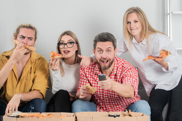 Friends watching TV. Pizza party together. Happy group friends eat pizza. Evening with tasty food. Friendship and home party. Joyful people having fun and relaxing together on pizza party.