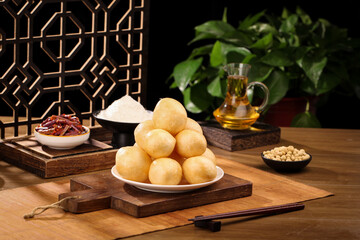 Traditional Asian Fried Dumplings with Oil and Spices on Wooden Serving Board