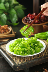 Fresh Tiger Skin Peppers Hunan Style - Traditional Chinese Stir-Fried Green Pepper Dish with Chopsticks