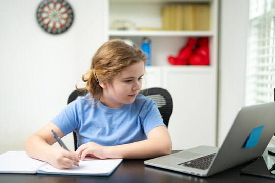 Kid learner writing notes. Child doing homework. School child studying. Child studying at home. Writing student with pencil. Kid writing in a notebook. Child at home school. Cute kid doing homework.