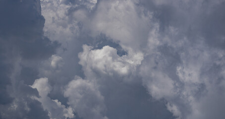 Sunny cloudy skies. Cumulus clouds in sky. Cloud wallpaper. Sky background. Cloudy sky with sunlight. White clouds wallpaper. Blue sky and white clouds background. Idyllic cloud.