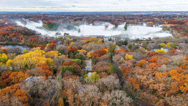 Aerial photography of the interaction between late autumn and early winter at Hyland Ski Hill