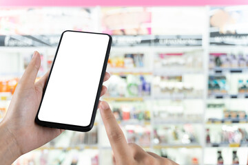 Blank smartphone screen in cosmetic store for shopping app mockup, retail technology and digital marketing