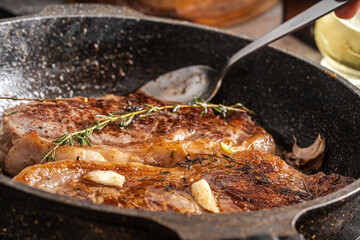 Beef stacks are pan-fried with rosemary and thyme. High quality photo