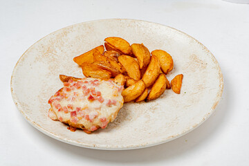 Succulent chicken baked to perfection with cheese and bacon, paired with crispy potato wedges